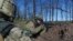 FILE - Ukrainian soldiers hold their position during a cease-fire, outside Avdiivka, Donetsk region, eastern Ukraine, April 16, 2016. 
