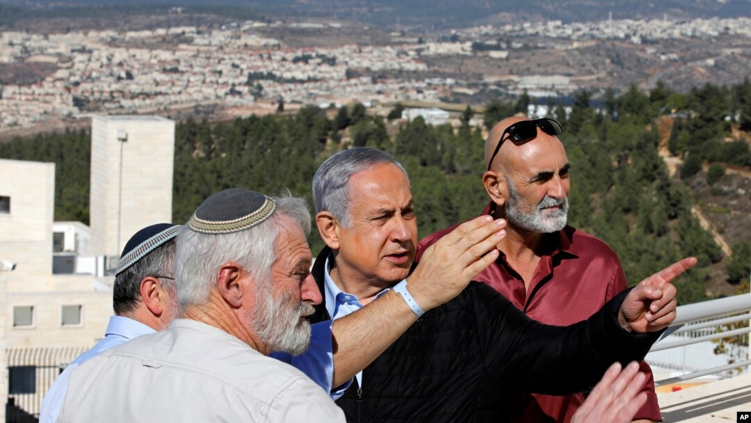 Israeli Prime Minister Benjamin Netanyahu, center, meets with heads of Israeli settlement authorities at the Alon Shvut settlement, in the Gush Etzion block, in the occupied the West Bank, Nov. 19, 2019. 