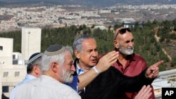 Israeli Prime Minister Benjamin Netanyahu, center, meets with heads of Israeli settlement authorities at the Alon Shvut settlement, in the Gush Etzion block, in the occupied the West Bank, Nov. 19, 2019. 