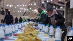 A table is prepared for iftar, the fast-breaking meal, on the first day of Ramadan in the Jobar neighborhood, which was devastated by the Syrian civil war, in Damascus, Syria, March 1, 2025.