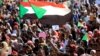 Sudanese protesters and wave flags during a rally at the Green Square in Khartoum, Sudan, July 18, 2019. 