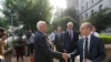 New York Times lawyer David McCraw, left, shakes hands with New York Times Publisher A.G. Sulzberger, after a meeting with Attorney General Merrick Garland at the Department of Justice, June 14, 2021, in Washington.