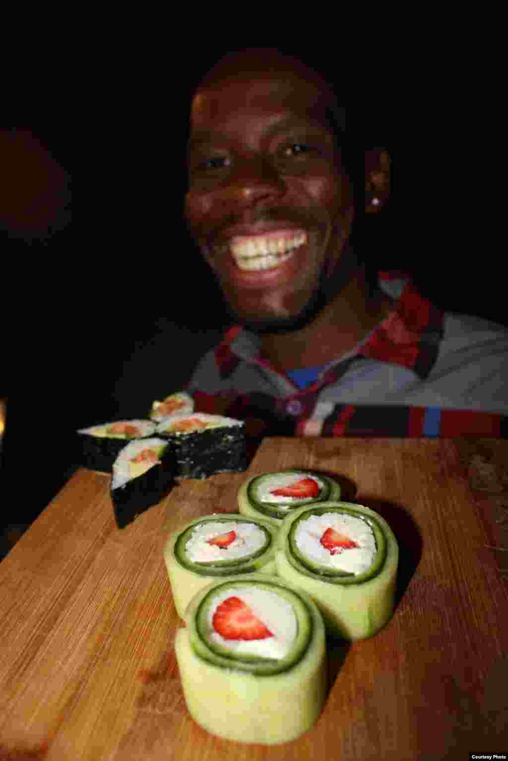 Chef Themba Khumalo grew up in a village in Mpumalenge province and now wields high-tensile carbon steel knives to craft red fillets of salmon for black South Africans. (Photo by Darren Taylor)