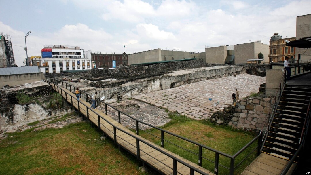FILE - People visit the Templo Mayor in Mexico City, Oct. 3, 2006.