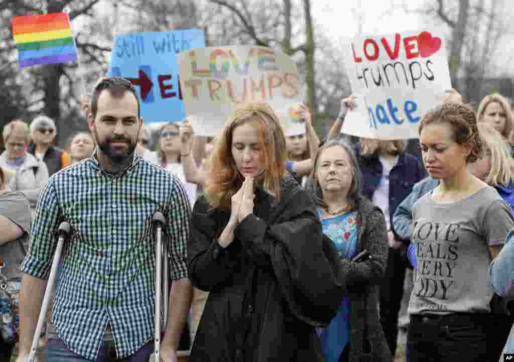 People take part in a protest organized to combat harsh rhetoric by Donald Trump in Nashville, Tenn., Jan. 20, 2017.