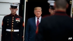 President Donald Trump walks out of the White House to greet South Korean President Moon Jae-in and his wife, April 11, 2019, in Washington.