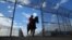 FILE - An inmate rides a wild horse as part of the Wild Horse Inmate Program ( WHIP) at Florence State Prison in Florence, Arizona.