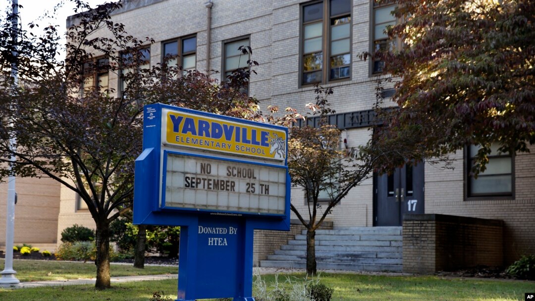 FILE - A sign is seen in front of the Yardville Elementary School in Hamilton Township, N.J., where a 4-year-old student died Thursday.