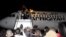 Passengers from a plane that was hijacked and diverted to Malta return to Tripoli's Mitiga International Airport, Libya, Dec. 24, 2016. 