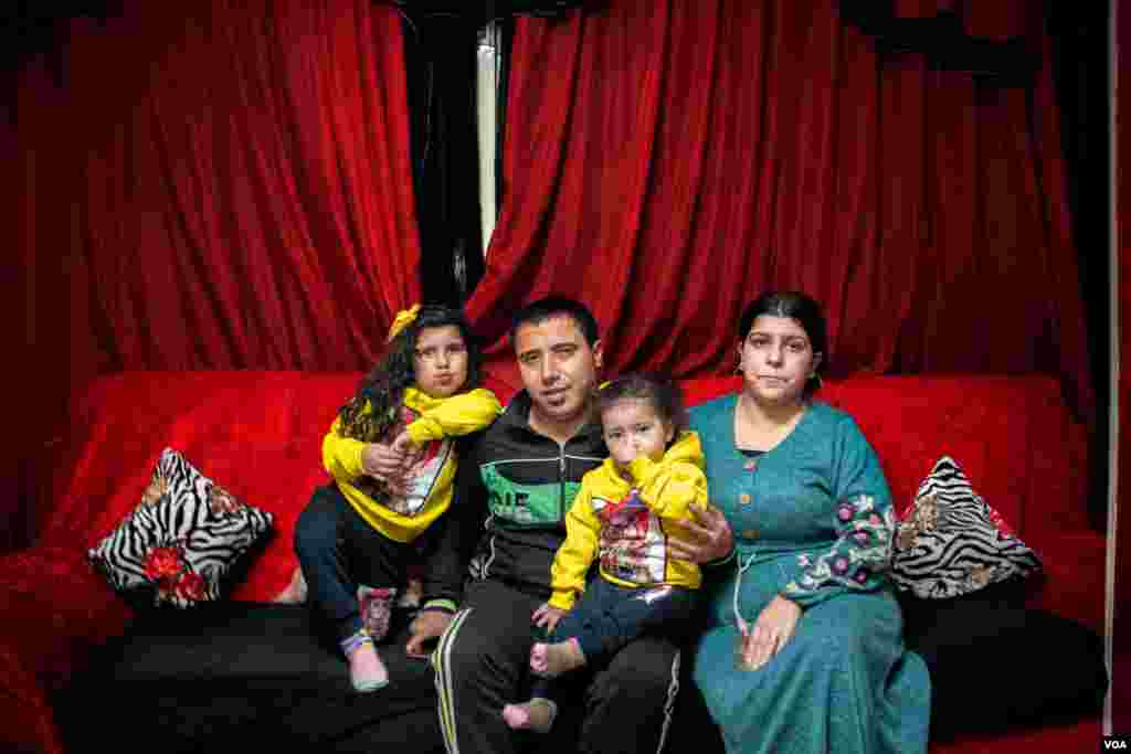 Sitting with his wife and daughters, Nazmy says, &quot;We weren&#39;t allowed to go to our church&#39;s Mass this holiday. We are almost getting used to these sad events interrupting our holidays,&quot; in Cairo, Jan. 6, 2021. (H. Elrasam/VOA)