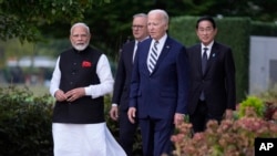 President Joe Biden, joined by Australia's Prime Minister Anthony Albanese, Japan's Prime Minister Fumio Kishida and India's Prime Minister Narendra Modi, walk at the Quad leaders summit in Claymont, Del., Sept. 21, 2024.