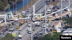 Aerial view shows a pedestrian bridge collapsed at Florida International University in Miami, Florida, March 15, 2018. 