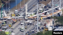 Aerial view shows a pedestrian bridge collapsed at Florida International University in Miami, Florida, March 15, 2018. 