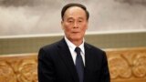 FILE - Wang Qishan attends a press event at Beijing's Great Hall of the People.