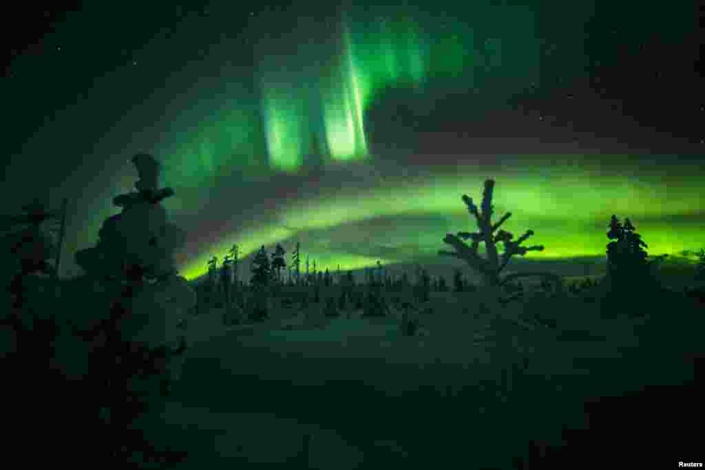 The Aurora Borealis (Northern Lights) is seen in the sky over Muonio in Lapland, Finland, Jan. 18, 2021.
