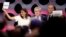 International Olympic Committee President Thomas Bach stands between Paris Mayor Anne Hidalgo, left, and Los Angeles Mayor Eric Garrett at the end of the IOC session in Lima, Peru, Sept. 13, 2017. 