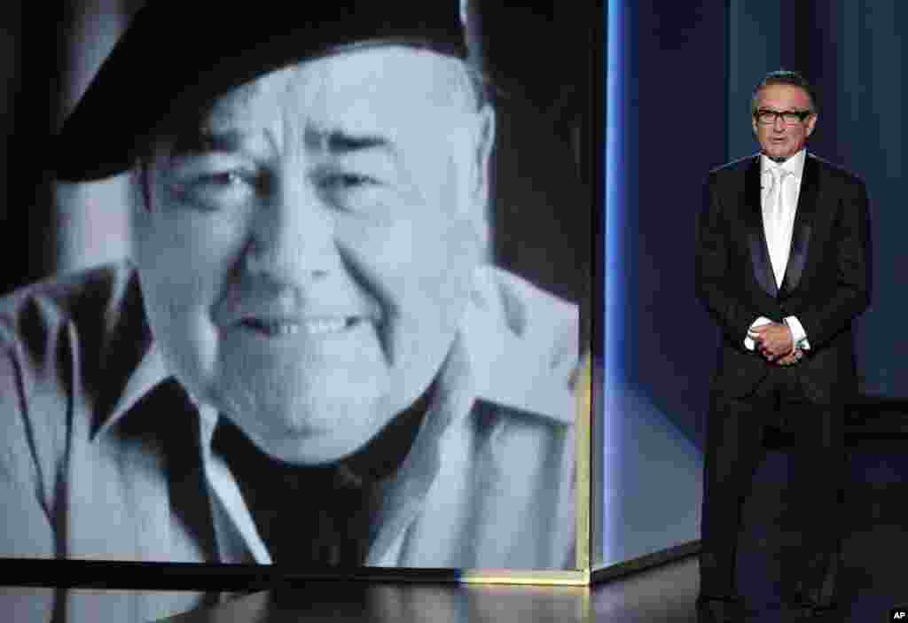 Robin Williams presents a tribute to Jonathan Winters on stage at the 65th Emmy Awards at Nokia Theater, Sept. 22, 2013, in Los Angeles.