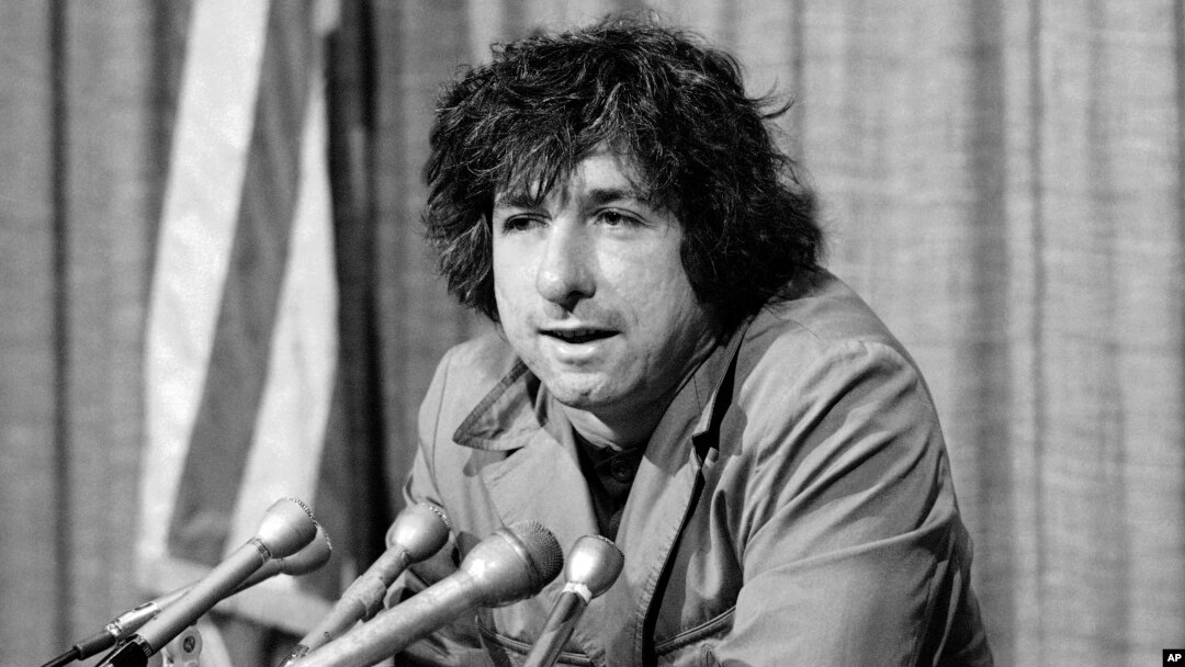 FILE - political activist Tom Hayden, husband of actress Jane Fonda, speaks to the press in Los Angeles, California, Dec. 6, 1973. Hayden and Fonda made a trip to North Vietnam in protest of the U.S. involvement in the war against Hanoi.