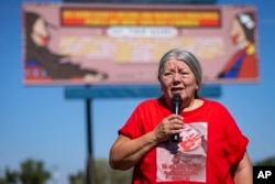 Kaysera Stops Pretty Places' grandmother, Yolanda Fraser speaks during a dedication ceremony for a billboard in support of the Missing and Murdered Indigenous People movement on Tuesday, Aug. 29, 2023, in Hardin, Montana. (AP Photo/Mike Clark)