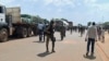 Troops from C.A.R. and Cameroon gather to escort trucks in Garoua Boulai, Cameroon, June 8, 2019. 