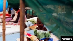 A malnourished girl plays at a hospital in a U.N. refugee camp in Malakal, July 24, 2014.