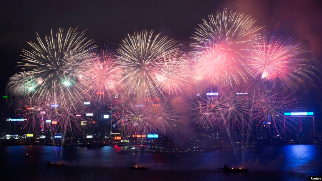 Fireworks explode over Victoria Harbour to celebrate the Chinese Lunar New Year in Hong Kong February 11, 2013. 