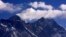 Cloud rise behind Mount Everest, the world's highest peak at 29,029 ft., viewed from Kongde, near Namche Bazar, Nepal, March 5, 2009.