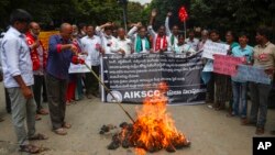 FILE - Indian farmers protest the Oct. 3 killing of four farmers in Uttar Pradesh state, Oct. 4, 2021, in Hyderabad, India. The farmers were run over by a car owned by India's junior home minister; the minister's son was arrested Oct. 9.