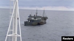 FILE - A video still released by Russia's Federal Security Service shows a North Korean boat during an incident in which Russian border guards detained two North Korean in the Sea of Japan on Sept. 17, 2019.