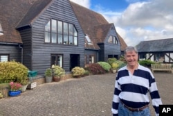 FILE - Stewart Lewis poses near his home in Abbots Langley, England, on Oct. 18, 2024.