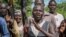 FILE - Opposition soldiers chant "Viva IO", meaning "long live the opposition", during a visit by a ceasefire monitoring team, at an opposition military camp near the town of Nimule in Eastern Equatoria state.