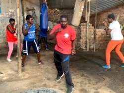 Hellen Baleke and other women warming up at Rhino boxing Club in Katanga slum, Kampala-Uganda.