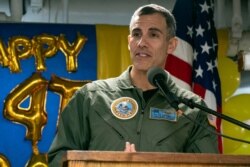 FILE - Capt. Carlos Sardiello, who was then the commanding officer of the aircraft carrier USS Theodore Roosevelt, addresses sailors in this Oct. 15, 2019, photo provided by the U.S. Navy.