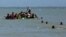 Rohingya refugees arriving on a makeshift boat