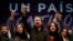 Pablo Iglesias, centro, y otros dirigentes del partido izquierdista Podemos, celebran los resultados electorales del domingo en España.