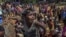A Rohingya Muslim boy, who crossed over from Myanmar into Bangladesh, pleads with aid workers to give him a bag of rice near Balukhali refugee camp, Bangladesh, Thursday, Sept. 21, 2017. 