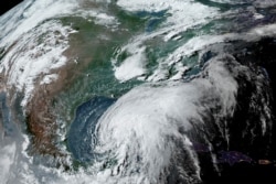 Tropical Storm Cristobal is seen on a northern track over the Gulf of Mexico in a satellite image.