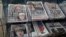 Newspapers fronted with photos of British Prime Minister Theresa May and others are displayed at a shop in Westminster in London, June 10, 2017.