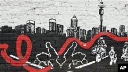 A wall mural in downtown Johannesburg shows a city skyline with an AIDS ribbon passing through workers who make a living in the town, 23 Nov 2010