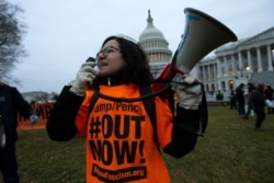 Demonstrators protest on the East Front of the Capitol after the impeachment acquittal of President Donald Trump, on Capitol Hill, in Washington, Feb. 5, 2020.