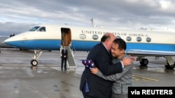 U.S. Ambassador to Switzerland Edward McMullen greets Xiyue Wang, the Chinese-Americanscholar freed by Iran, in Zurich, Switzerland December 7, 2019.