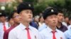 FILE - People watch a news broadcast on a missile launch in Pyongyang, North Korea, July 29, 2017. North Korean leader Kim Jong Un said the second flight test of an intercontinental ballistic missile demonstrated his country could hit the U.S. mainland.