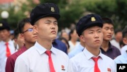 FILE - People watch a news broadcast on a missile launch in Pyongyang, North Korea, July 29, 2017. North Korean leader Kim Jong Un said the second flight test of an intercontinental ballistic missile demonstrated his country could hit the U.S. mainland.