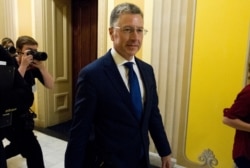 FILE - Kurt Volker, a former special envoy to Ukraine, leaves after a closed-door interview with House investigators at the Capitol in Washington, Oct. 3, 2019.