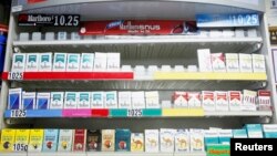 FILE - Cigarettes displayed in a store in New York.