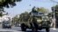 MYANMAR - Military vehicles are seen along a street in Mandalay on February 2, 2021, as Myanmar's generals appeared in firm control a day after a surgical coup that saw leader Aung San Suu Kyi detained.