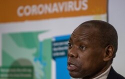 FILE - South African Minister of Health Zweli Mkhize speaks during the handover of  emergency medical equipment for COVID-19 from China, at OR Tambo Johannesburg, South Africa, April 14, 2020.