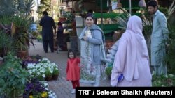 Aneela Karim and her 5-year-old daughter Rukhsana Gul visit a nursery in Islamabad, Pakistan’s capital, March 7, 2018. 