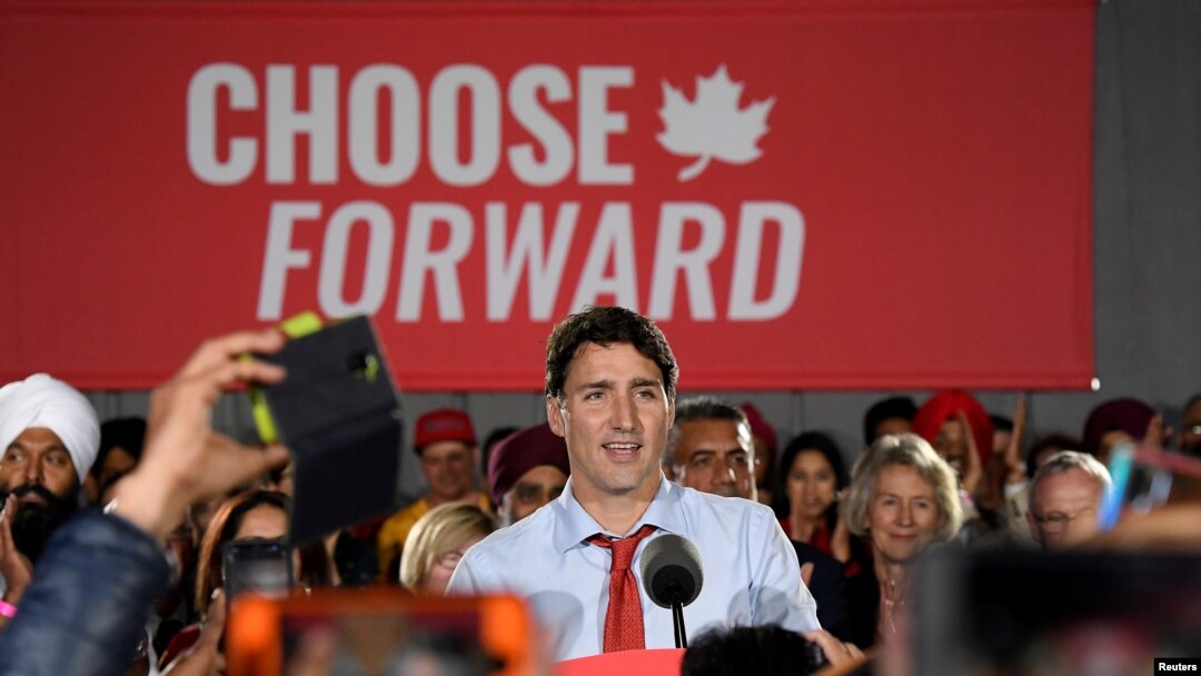 FILE - Canada's Prime Minister Justin Trudeau speaks with supporters during an election campaign rally in Surrey, British Columbia, Canada, Sept. 24, 2019. 
