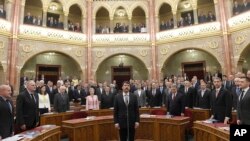 Hungarian President Janos Ader (C) swears in during his inauguration ceremony for a second five-year term attended by Hungarian Prime Minister Viktor Orban )front row, 3rd R) at the plenary session of the Hungarian Parliament in Budapest, Hungary, May 8, 